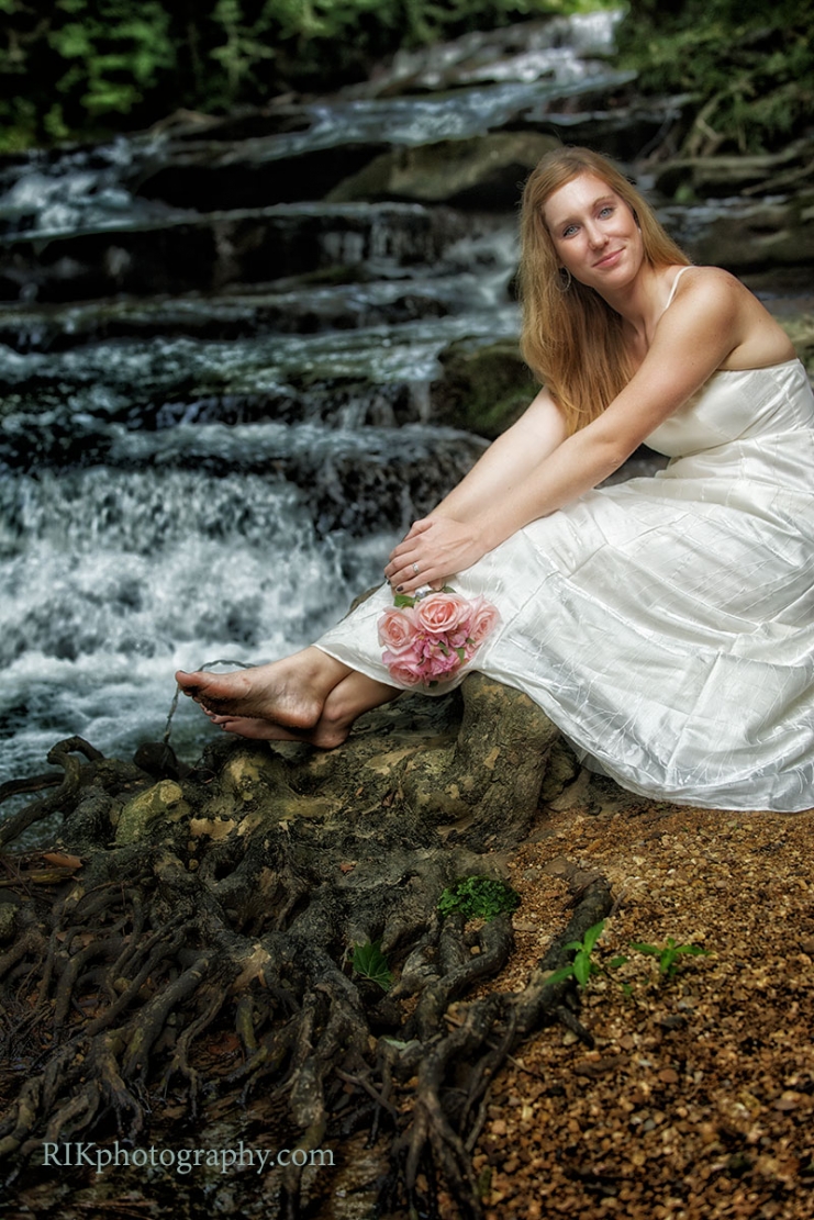 bride by a waterfall