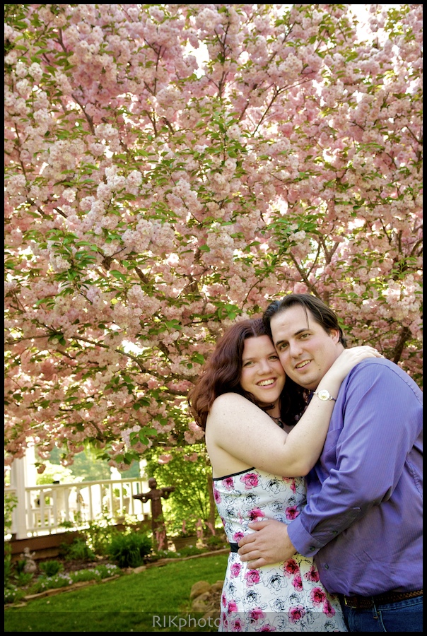 couple in front of blooming tree