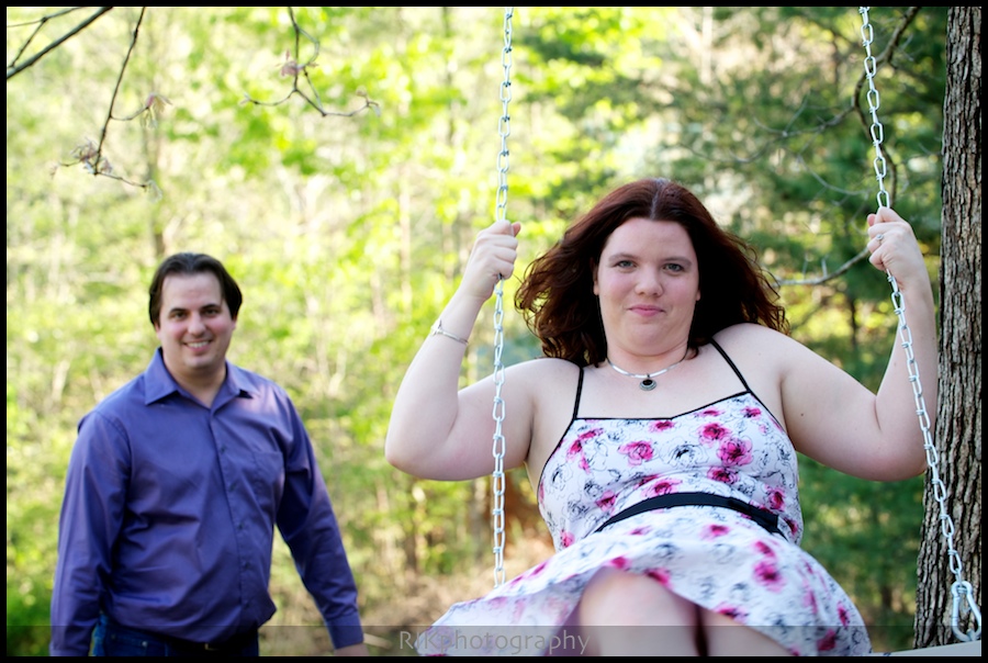 bride on a swing as groom pushes her